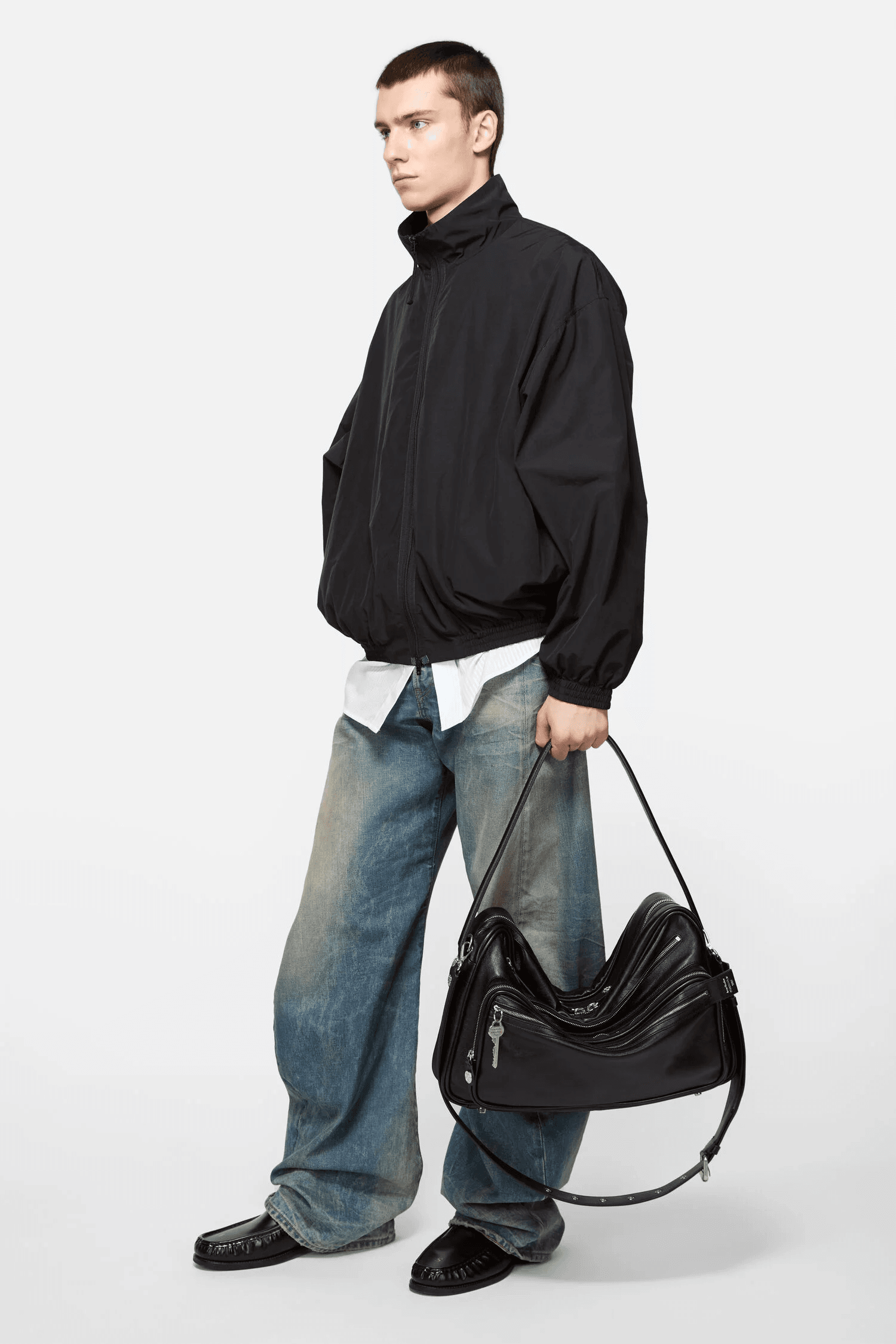 A model holding the Acne Studios Camero bag.
