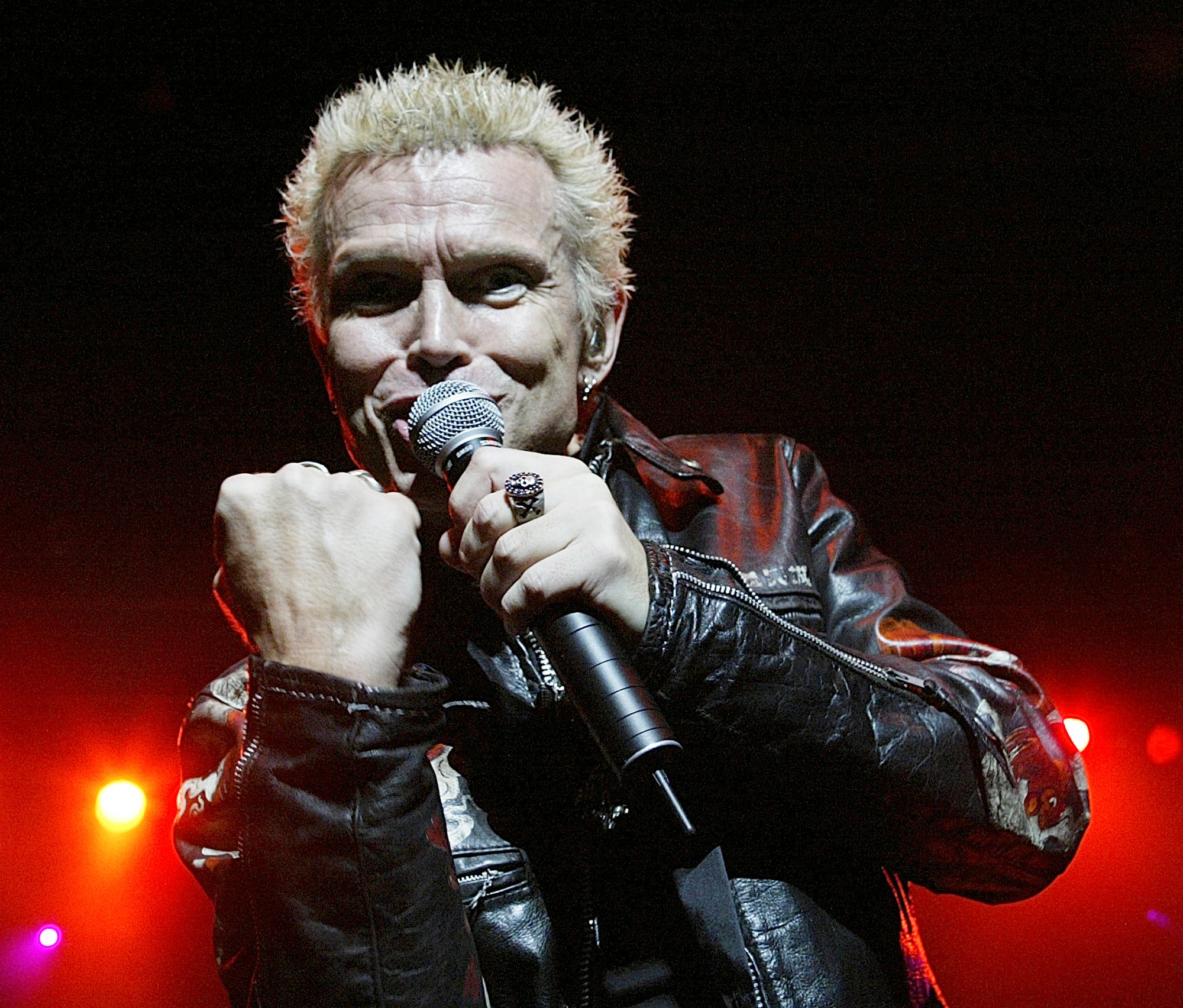 Rocker Billy Idol performing live in concert.